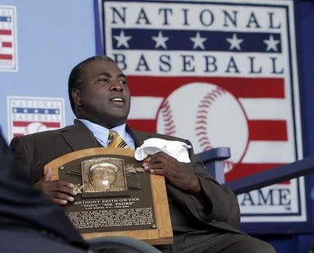 Hall of Fame ball player Tony Gwynn signs a 1998 jersey during