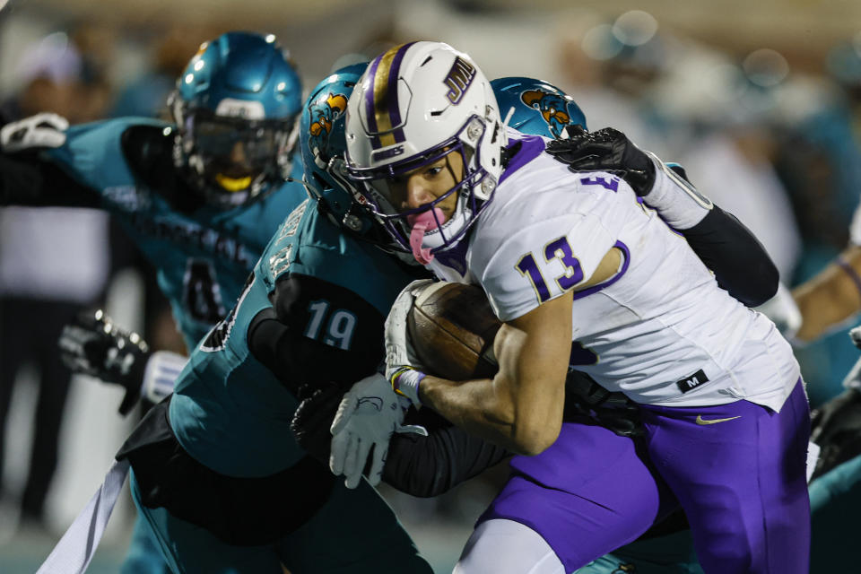 James Madison wide receiver Elijah Sarratt (13) runs for a touchdown against Coastal Carolina during the second half of an NCAA college football game in Conway, S.C., Saturday, Nov. 25, 2023. (AP Photo/Nell Redmond)