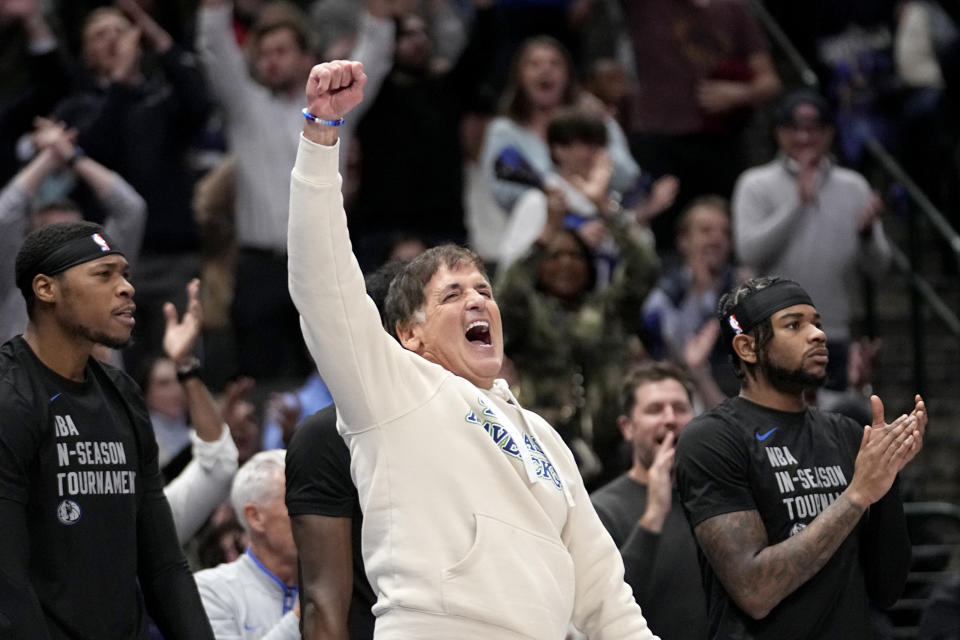 Dallas Mavericks team owner Mark Cuban celebrates late in the second half of an NBA basketball game against the Houston Rockets in Dallas, Tuesday, Nov. 28, 2023. (AP Photo/Tony Gutierrez)