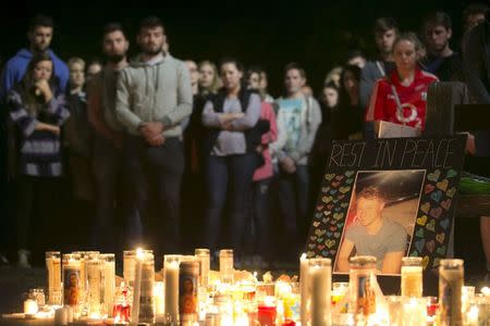 A picture of Niccolai Schuster is seen at a memorial during a candlelight vigil for the victims of the Berkeley balcony collapse in Berkeley, California June 17, 2015. REUTERS/Elijah Nouvelage