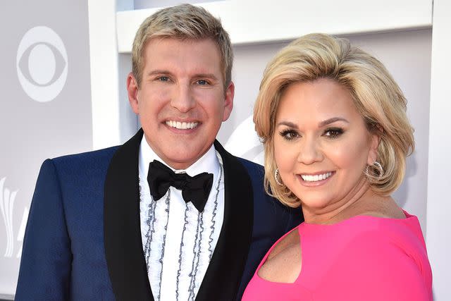 <p>Kevin Mazur/ACMA2017/Getty</p> Todd Chrisley (L) and Julie Chrisley attend the 52nd Academy Of Country Music Awards at Toshiba Plaza on April 2, 2017 in Las Vegas, Nevada.