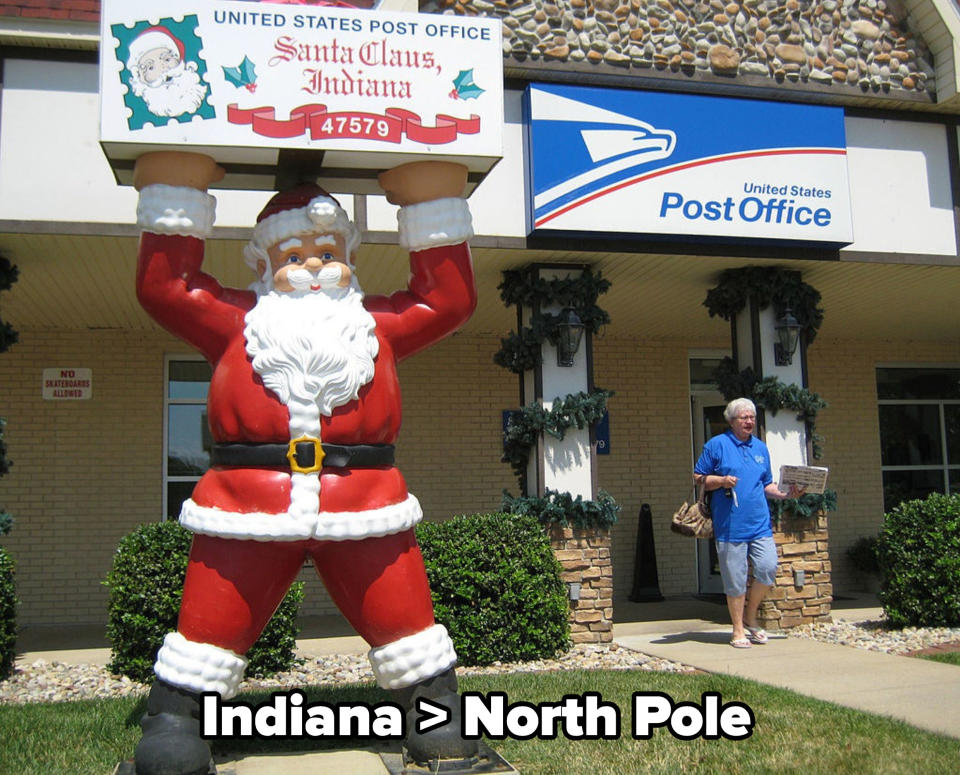 the post office at Santa Claus, with a giant statue of Santa out the front, with caption: Indiana &gt; North Pole