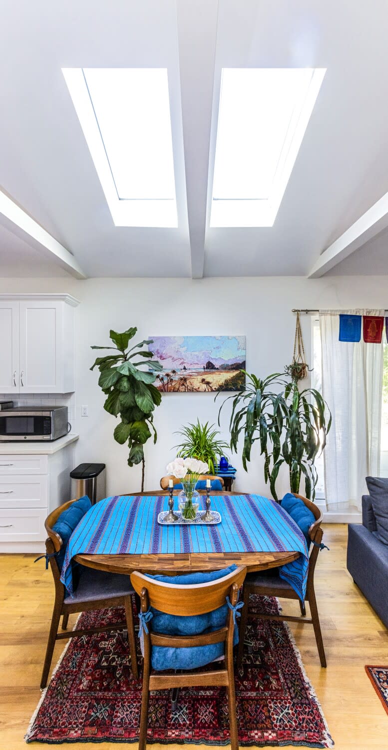 Skylights illuminate a dining room table