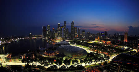 A general view shows part of the illuminated street circuit of the Singapore Formula One Grand Prix at dusk September 23, 2008. REUTERS/Tim Chong/File Photo