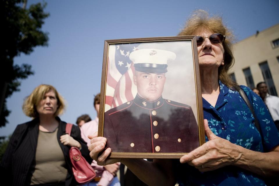A mother holds a photo of her son, U.S. Marine Cpl. Edward Johnston, at a 2007 remembrance with family members and loved ones of victims from a 1983 terrorist attack on Americans in Beirut. <a href="https://www.gettyimages.com/detail/news-photo/edwin-marian-johnston-hold-up-a-photo-of-her-son-us-marine-news-photo/76572051?adppopup=true" rel="nofollow noopener" target="_blank" data-ylk="slk:Brendan Smialowski/Getty Images;elm:context_link;itc:0;sec:content-canvas" class="link ">Brendan Smialowski/Getty Images</a>