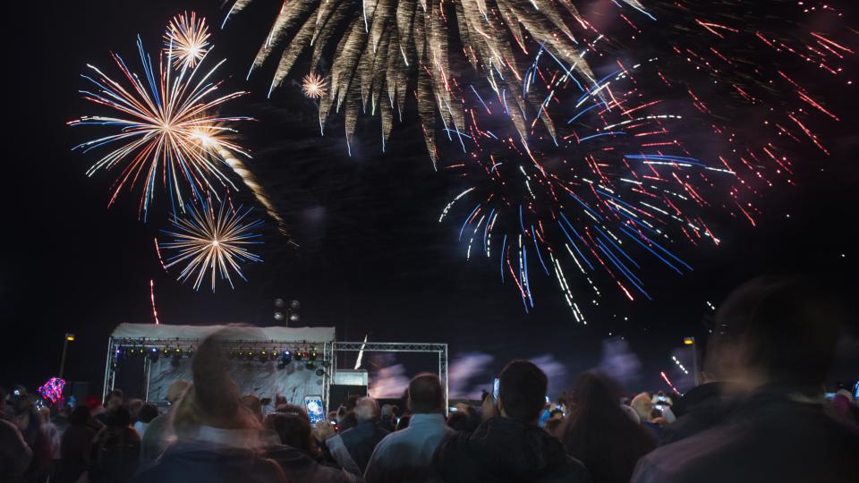 Fireworks burst over Pier Park in St. Augustine Beach as hundreds of people gather to celebrate New Year's Eve at Beach Blast Off on Sunday, Dec. 31, 2017.