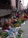 Women sell their ware in an alley adjoining the Ima Market.