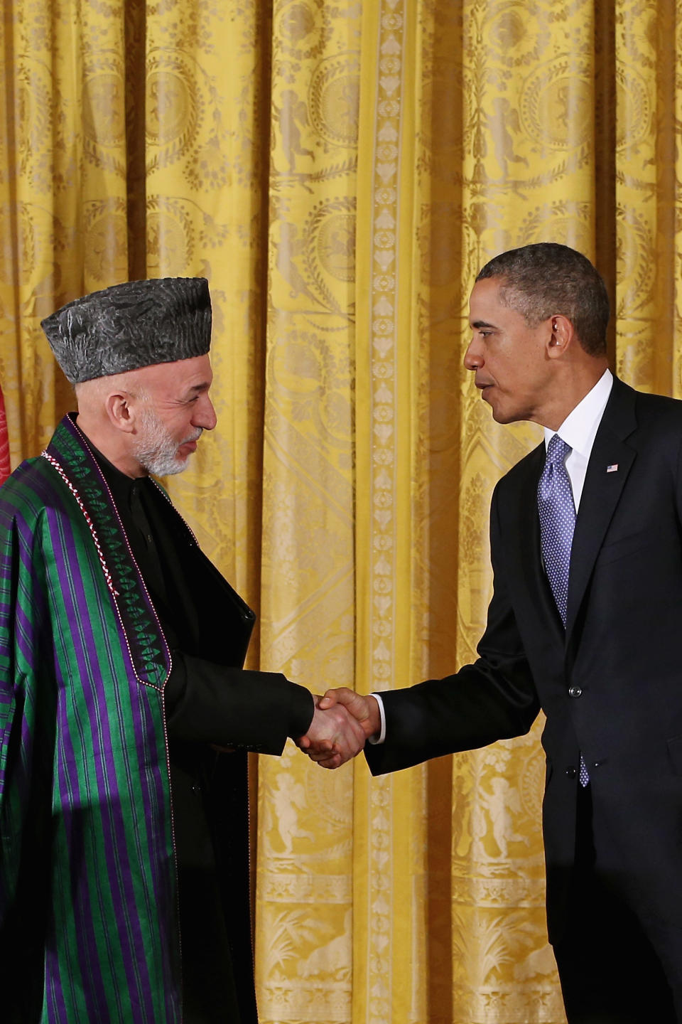 Afghanistan President Hamid Karzai and U.S. President Barack Obama shake hands after a joint news conference in the East Room of the White House on Jan. 11, 2013 in Washington, D.C.&nbsp;