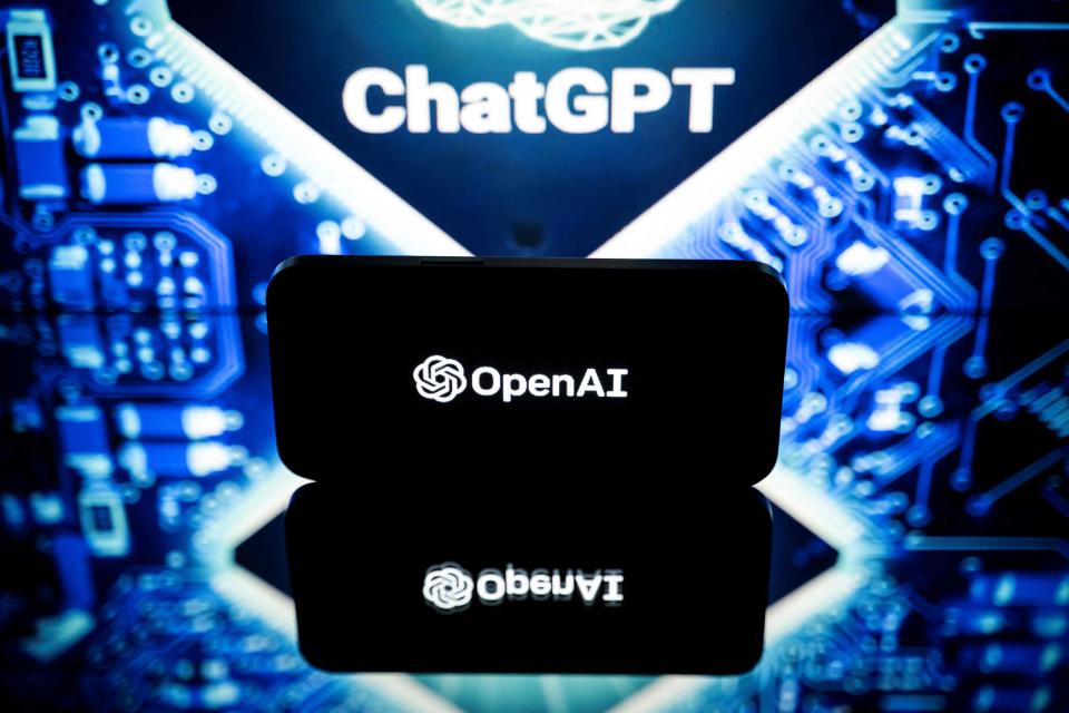 This picture taken on January 23, 2023 in Toulouse, southwestern France, shows screens displaying the logos of OpenAI and ChatGPT. - ChatGPT is a conversational artificial intelligence software application developed by OpenAI.