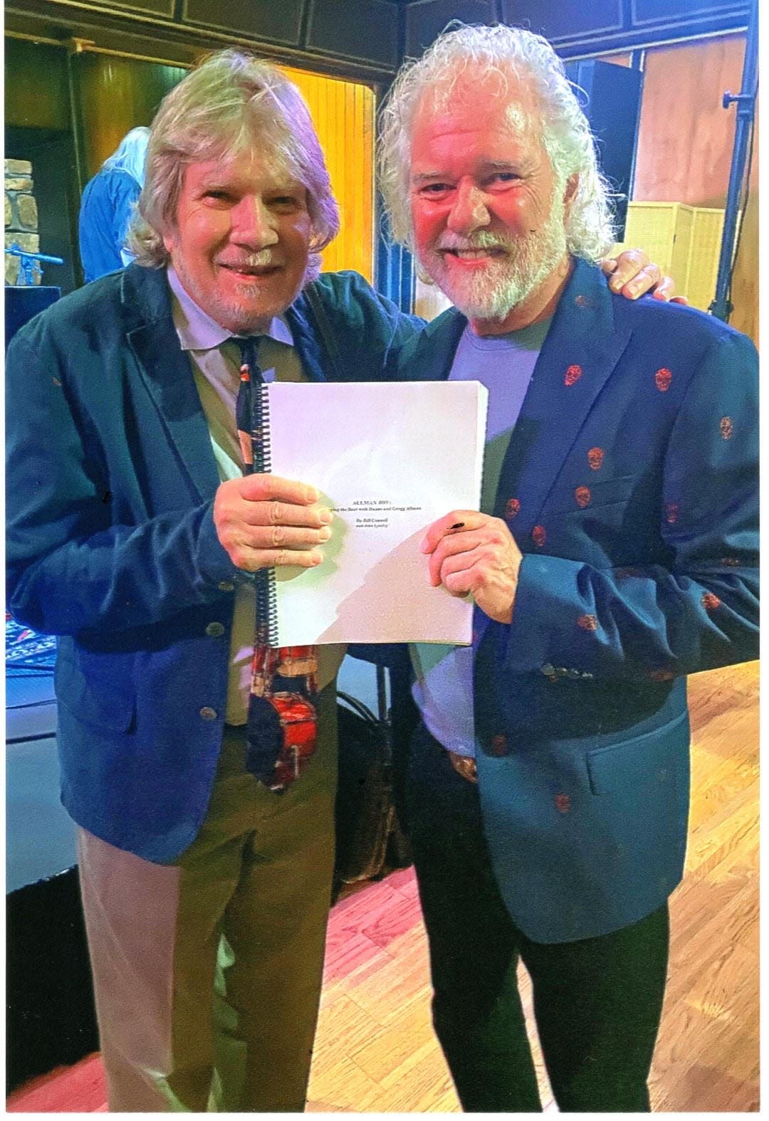 Bill Connell and Chuck Leavell hold a copy of the original manuscript of the Tuscaloosan's memoir, "Allman Joy: Keeping the Beat with Duane and Gregg," in this photo from September 2022, taken by Jackie Sullivan.