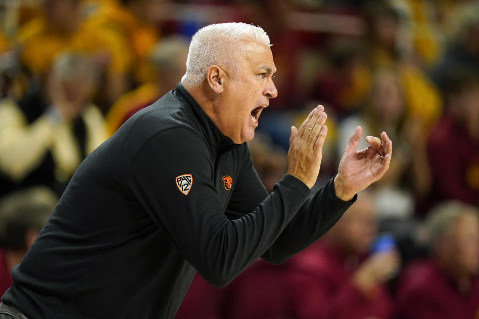 Oregon State head coach Wayne Tinkle applauds his team during the first half of an NCAA college basketball game against Iowa State, Friday, Nov. 12, 2021, in Ames, Iowa. (AP Photo/Charlie Neibergall)