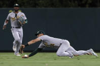 Oakland Athletics right fielder Chad Pinder can't catch a fly ball hit by Los Angeles Angels' Jared Walsh during the seventh inning of a baseball game in Anaheim, Calif., Saturday, Sept. 18, 2021. (AP Photo/Alex Gallardo)