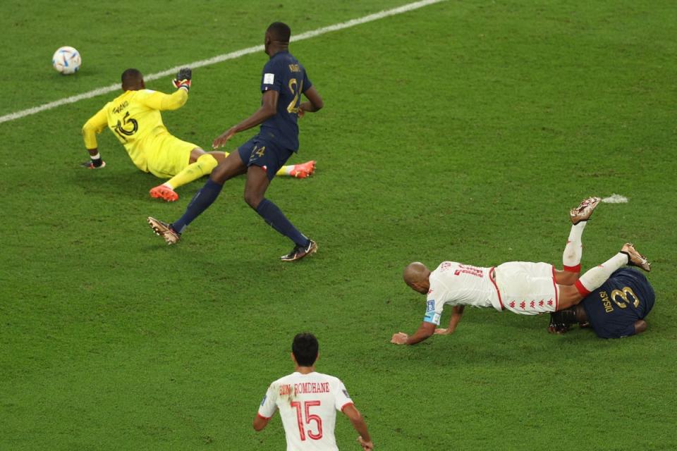 Tunisia’s forward Wahbi Khazri falls as he scores (AFP via Getty Images)