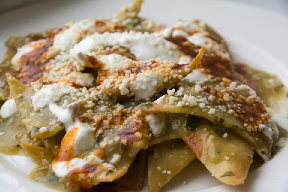 Chilaquiles with salsa verde and cheese.