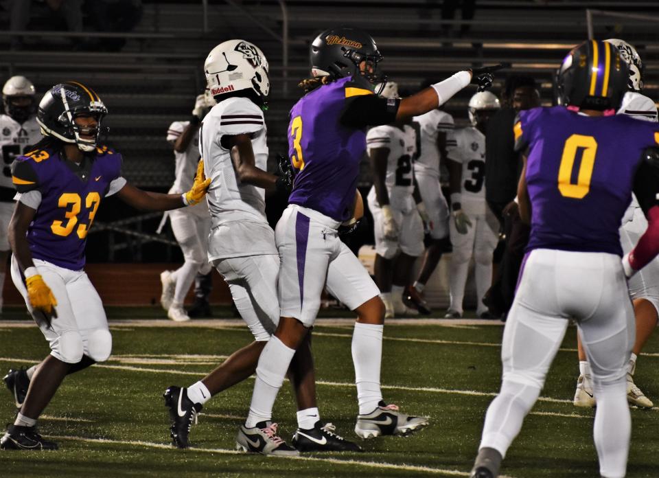 Hickman defensive back Rodney McNeil celebrates after intercepting a pass during Hickman's game against Belleville West at Hickman High School on Oct. 20, 2023, in Columbia, Mo.