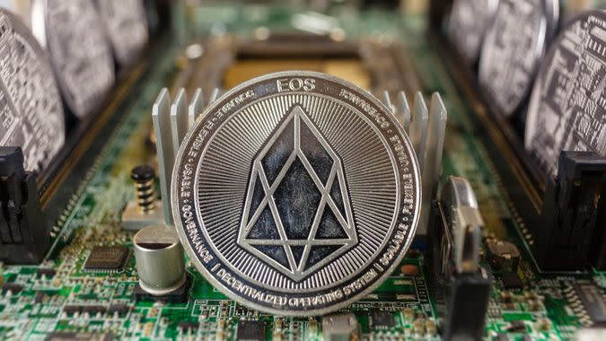 EOS coinclose-up on a computer circuit motherboard as a blockchain technology payment network.