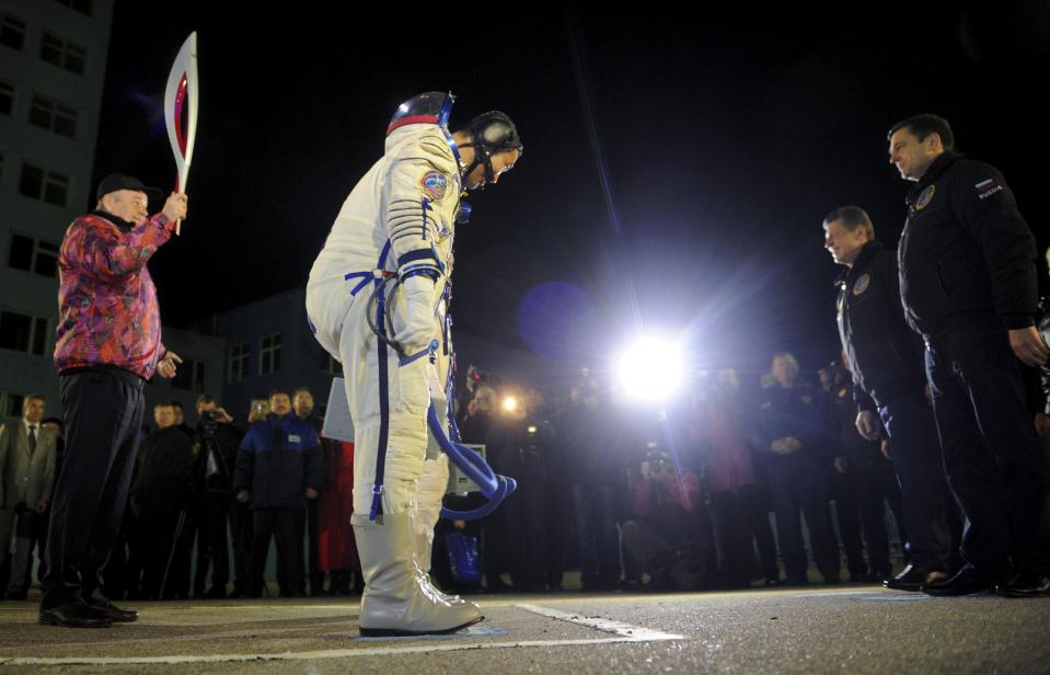 Russia's Roscosmos space agency chief Ostapenko greets ISS crew members at the Baikonur cosmodrome