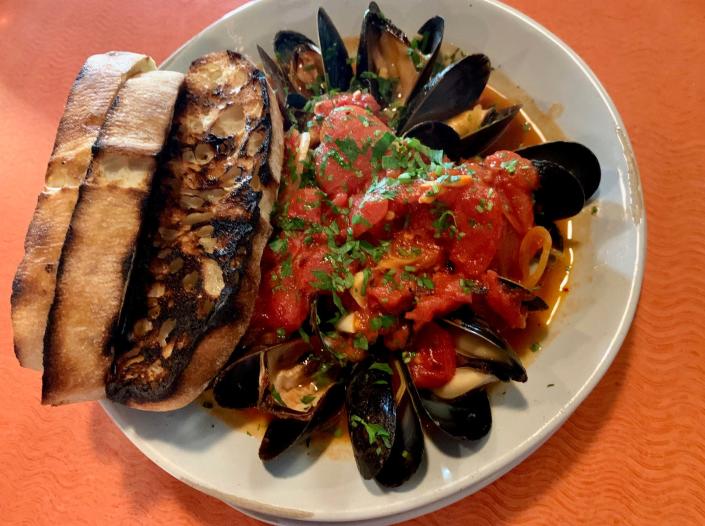 The G.O.A.T.&#39;s saffron, garlic and crushed tomato adorned mussels was a standout. It&#x002019;s served with charred bread for dipping.