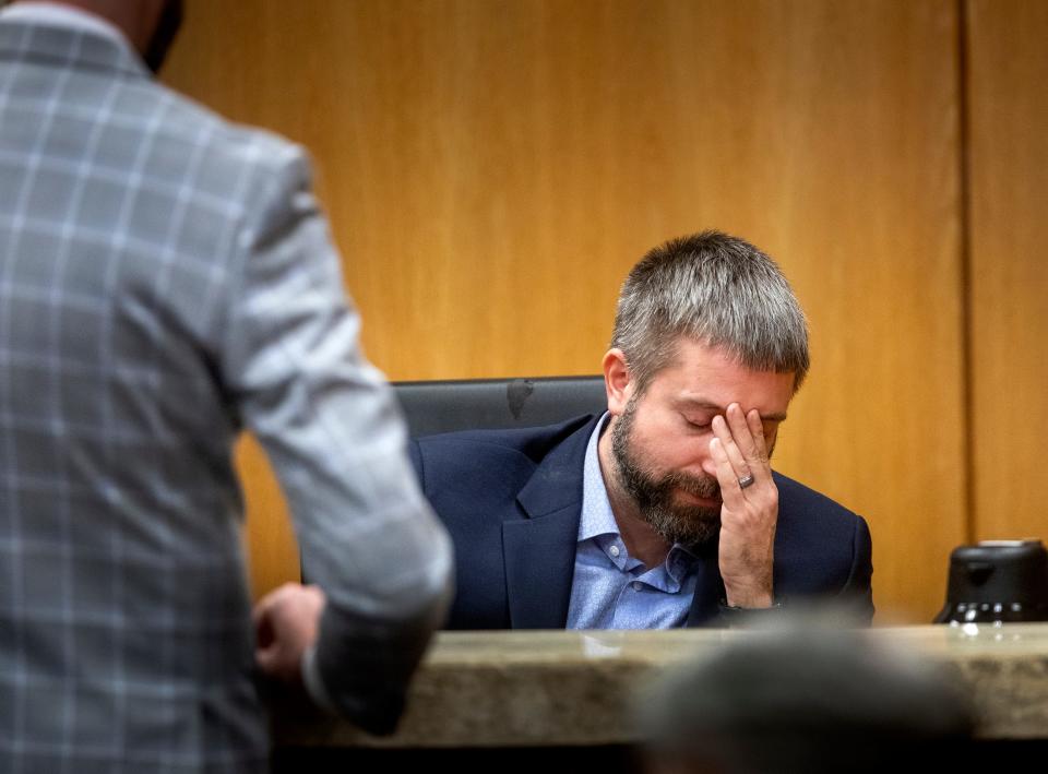 Todd Baylis, son, of Edie Yates Henderson reacts to crime-scene photos during first day of testimony in Marcelle Waldon's trial. Baylis called 911 the day of the killings after coming to the home to check on his parents.