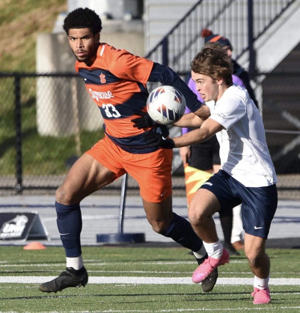 UNH sophomore Taig Healy, a 2022 graduate of St. Thomas Aquinas, controls the ball during Sunday's NCAA second-round men's soccer game against Syracuse at Wildcat Stadium. Healy scored the game-winning goal in UNH's 3-0 win over the defending national champions.