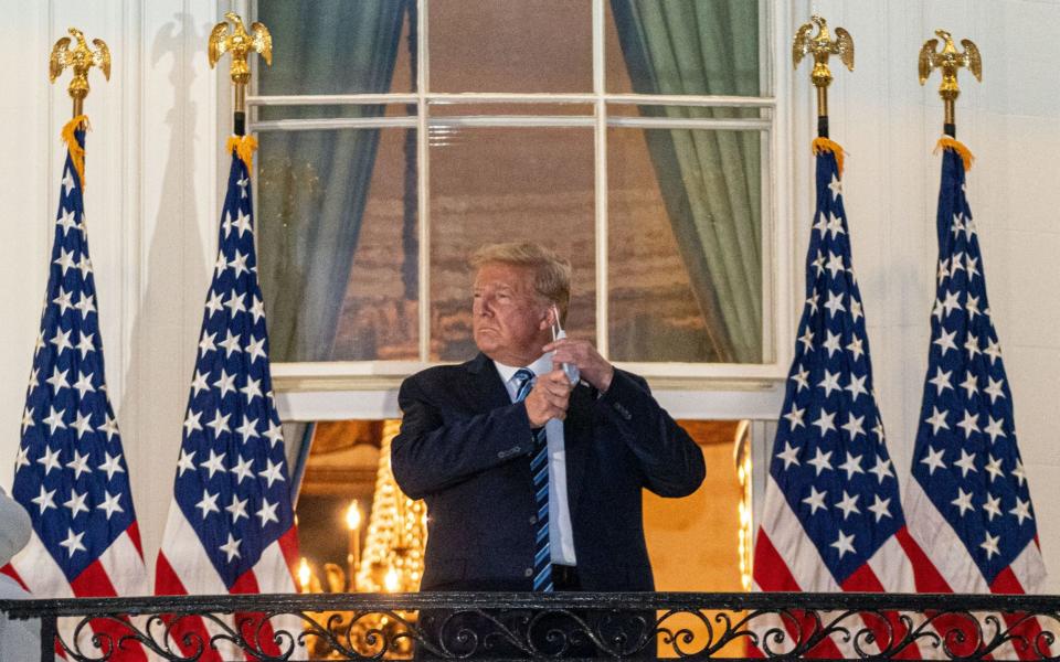 Donald Trump takes off his mask after returning to the White House - KEN CEDENO/POOL/EPA-EFE/Shutterstock