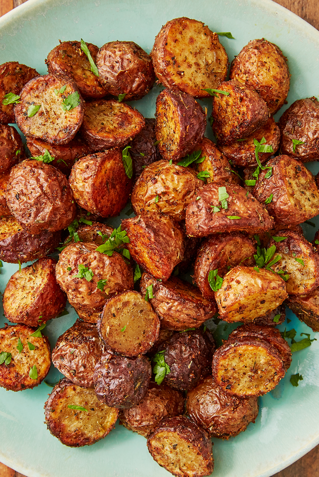 <p>We pride ourselves for how perfect our <a href="https://www.delish.com/uk/cooking/recipes/a28786247/herb-roasted-potatoes/" rel="nofollow noopener" target="_blank" data-ylk="slk:roasted potatoes;elm:context_link;itc:0;sec:content-canvas" class="link ">roasted potatoes</a> are. We truly thought they couldn't get be any better, but it turns out the air fryer works some kind of magic on potatoes. They get extra crispy all over and stay perfectly soft on the inside. Toss them in just a little bit of oil so all of the seasonings stick to make these the most addicting potatoes ever. </p><p>Get the <a href="https://www.delish.com/uk/cooking/recipes/a30376680/air-fryer-potatoes-recipe/" rel="nofollow noopener" target="_blank" data-ylk="slk:Air Fryer Potatoes;elm:context_link;itc:0;sec:content-canvas" class="link ">Air Fryer Potatoes</a> recipe.</p>