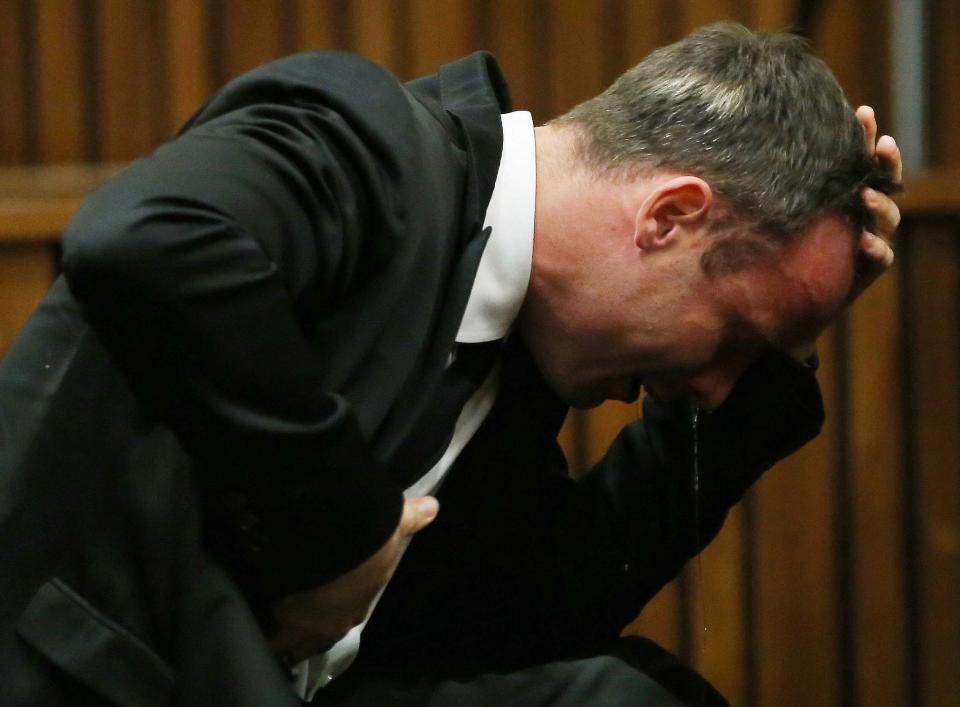 Oscar Pistorius weeps as he listens to evidence by a pathologist in court in Pretoria, South Africa, Monday, April 7, 2014. Pistorius is charged with murder for the shooting death of his girlfriend Reeva Steenkamp, on Valentines Day 2013. (AP Photo/Themba Hadebe, Pool)