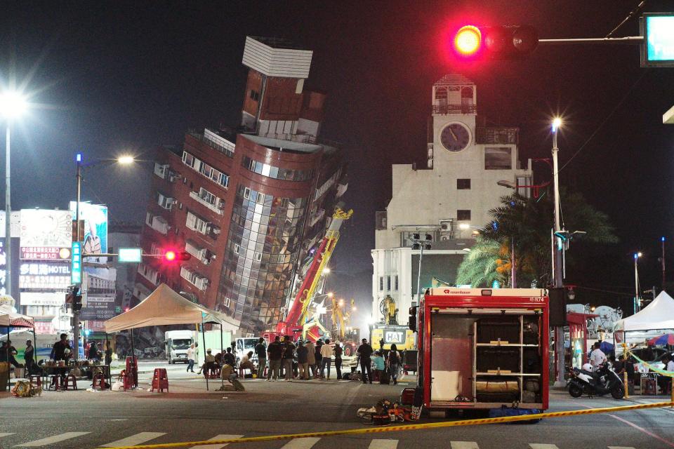 image of partially collapsed building leaning over street