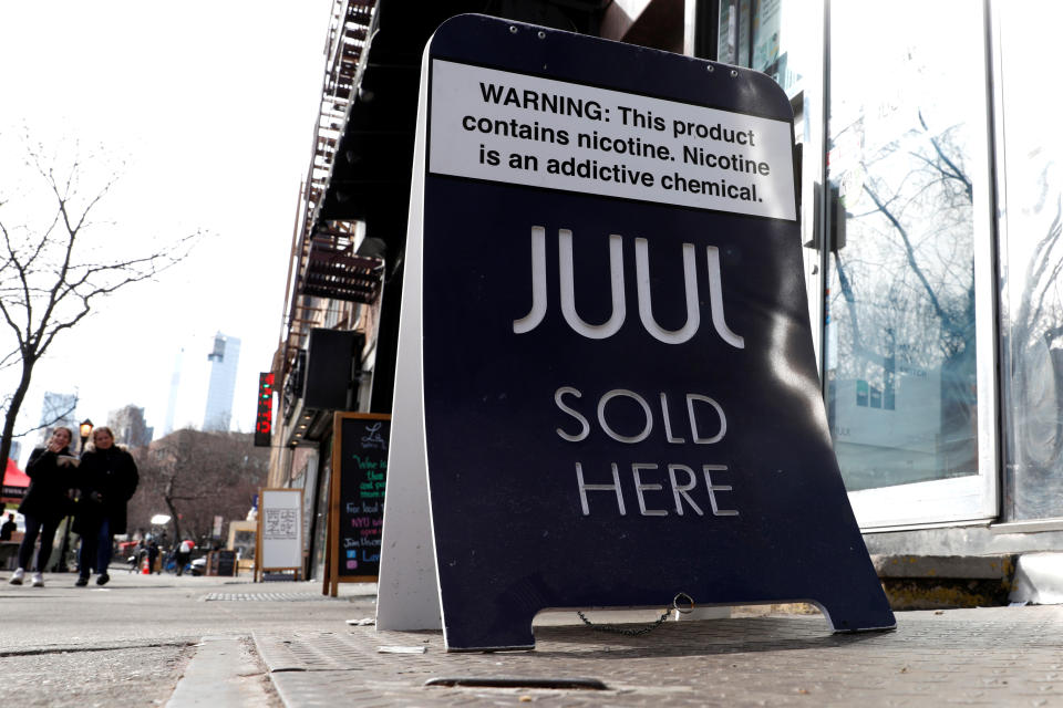 A sign advertising Juul brand vaping products is seen outside a shop in Manhattan in New York City, New York, U.S., February 6, 2019. REUTERS/Mike Segar