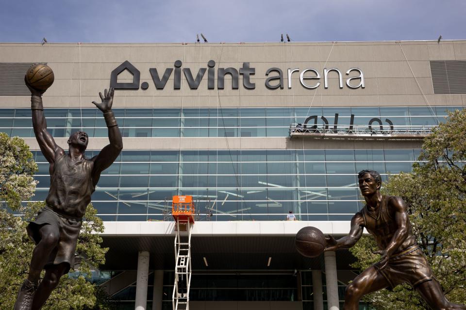 Crews remove Vivint Arena signage from the arena that serves as home to the Utah Jazz in Salt Lake City on Wednesday, May 3, 2023. As of July 1 the arena will once again be known as the Delta Center, which was the venue’s name from its opening in 1991 until 2006. | Spenser Heaps, Deseret News