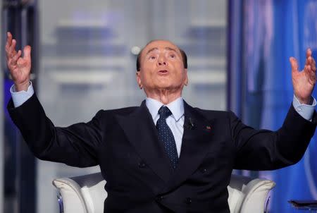 Italy's former Prime Minister Silvio Berlusconi gestures during the television talk show "Porta a Porta" (Door to Door) in Rome, Italy June 21, 2017. REUTERS/Remo Casilli