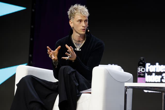<p>Taylor Hill/Getty</p> Machine Gun Kelly at the 2023 Forbes 30 Under 30 Summit in Cleveland on Oct. 10, 2023