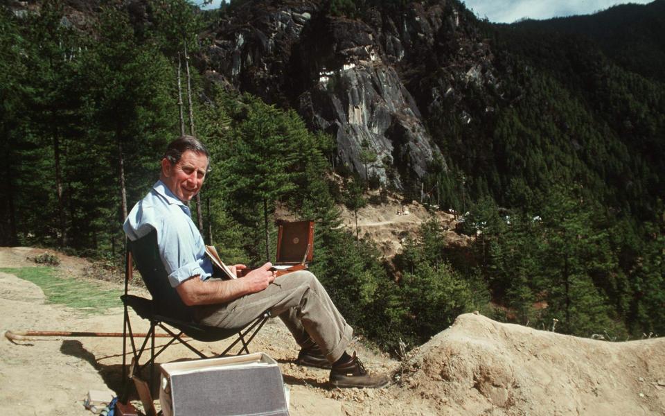 King Charles, then the Prince of Wales, painting in Paro, Bhutan, in 1998 - PA