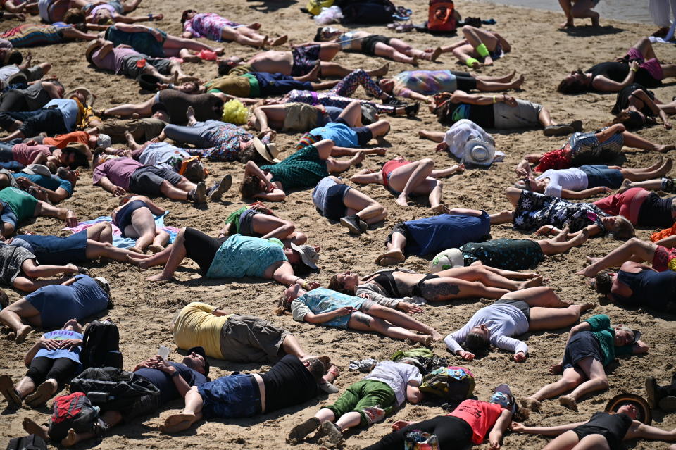 <p>ST IVES, CORNWALL - JUNE 13: Extinction Rebellion environmental activists stage a 'die-in' demonstration on the sand at the harbour during the G7 summit on June 13, 2021 in St Ives, England. Environmental Protest Groups gather in Cornwall as the UK Prime Minister, Boris Johnson, hosts leaders from the USA, Japan, Germany, France, Italy and Canada at the G7 Summit in Carbis Bay. This year the UK has invited Australia, India, South Africa and South Korea to attend the Leaders' Summit as guest countries as well as the EU. Protest groups hope to highlight their various causes to the G7 leaders and a global audience as the eyes of the world focus on Cornwall during the summit. (Photo by Jeff J Mitchell/Getty Images)</p>
