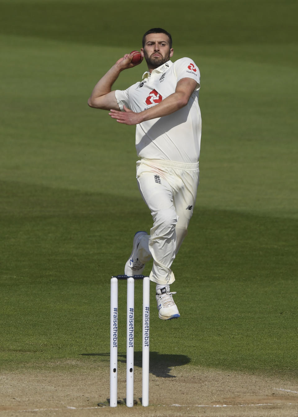 England's Mark Wood bowls during the fifth day of the first cricket Test match between England and West Indies, at the Ageas Bowl in Southampton, England, Sunday, July 12, 2020. (Mike Hewitt/Pool via AP)