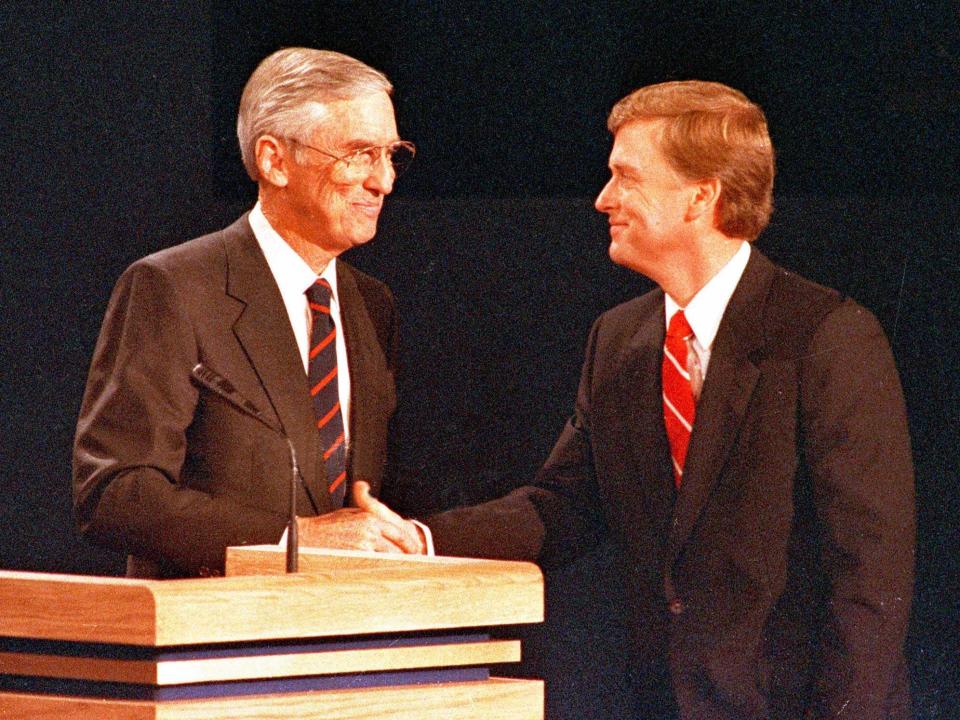 1988 Democratic vice presidential nominee Lloyd Bentsen and his GOP opponent, Dan Quayle, shake hands after their one and only debate in Omaha, Nebraska, on October 5, 1988.