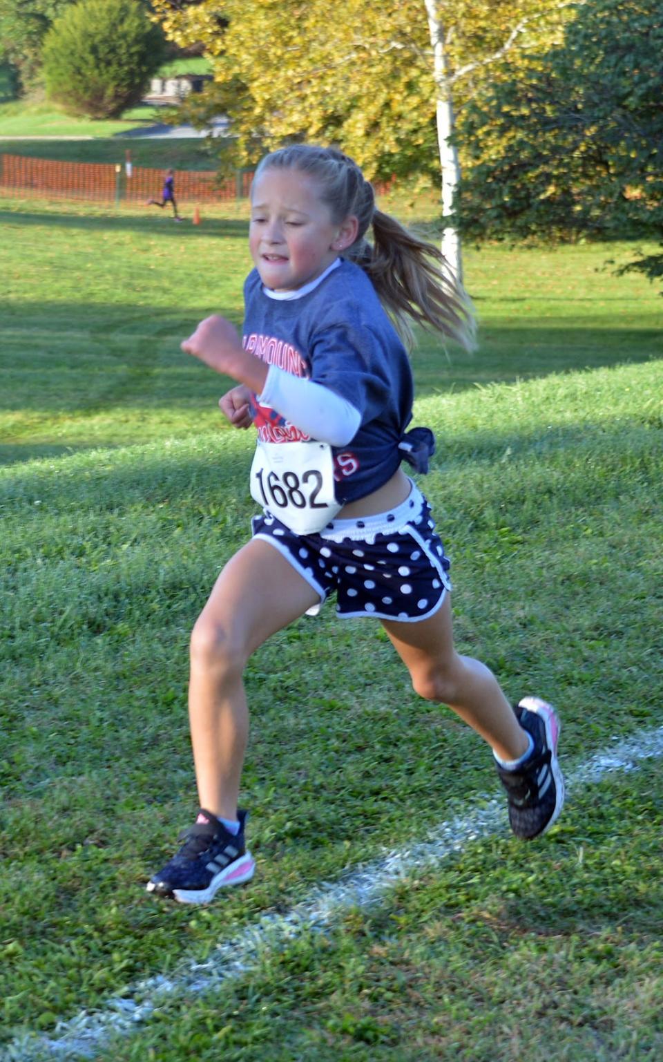 Paramount's Addison Philp runs to the finish line to win the third-grade girls race during the 2022 WCPS Elementary School Cross Country run at Eastern Elementary in Hagerstown on Oct. 8.