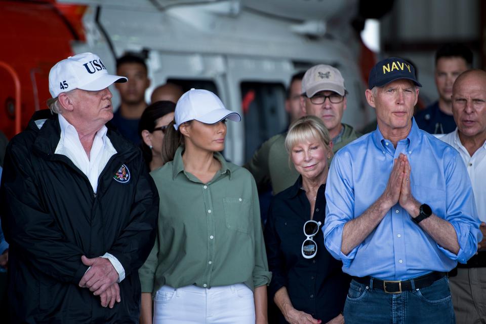 <p>President Donald Trump (L), First Lady Melania Trump (2nd L) listen to Florida Governor Rick Scott as he speaks during a briefing on Hurricane Irma relief efforts at Southwest Florida International Airport in Fort Myers, Sept. 14, 2017, in Fort Myers, Fla. (Photo: Brendan Smialowski/AFP/Getty Images) </p>