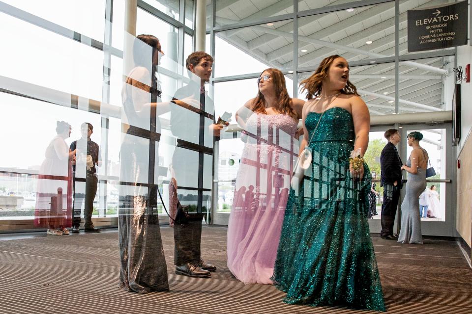 McDowell students are shown, on May 21, 2022, at the entrance to the Enchanted Forest-themed McDowell High School prom held at the Bayfront Convention Center in Erie.