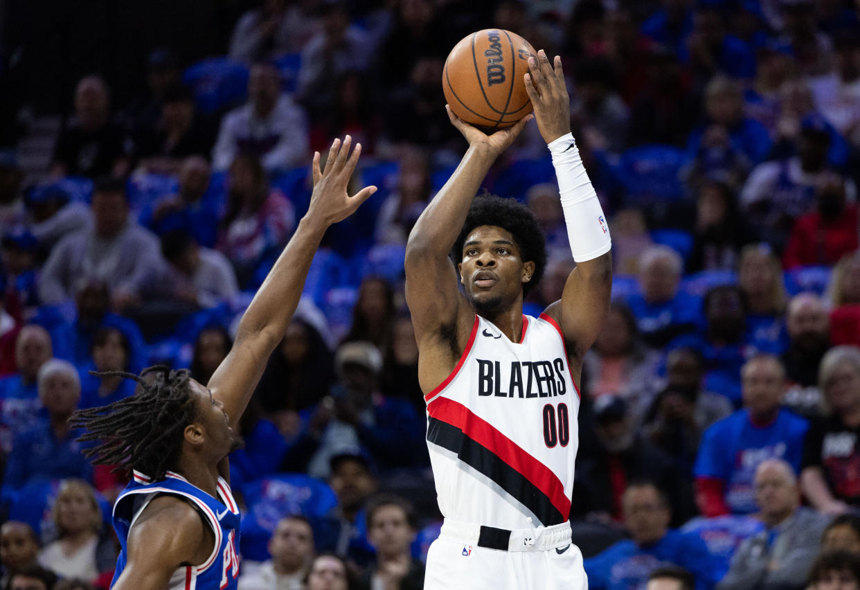 Oct 29, 2023; Philadelphia, Pennsylvania, USA; Portland Trail Blazers guard Scoot Henderson (00) shoots past Philadelphia 76ers guard Tyrese Maxey (0) during the first quarter at Wells Fargo Center. Mandatory Credit: Bill Streicher-USA TODAY Sports