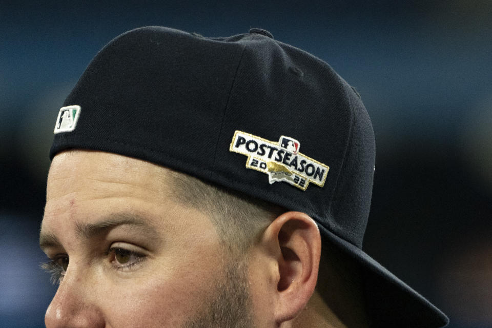 Seattle Mariners infielder Ty France watches from behind the batting cage during a baseball workout, Thursday, Oct. 6, 2022, in Toronto ahead of the team's wildcard playoff game against the Toronto Blue Jays. (Alex Lupul/The Canadian Press via AP)