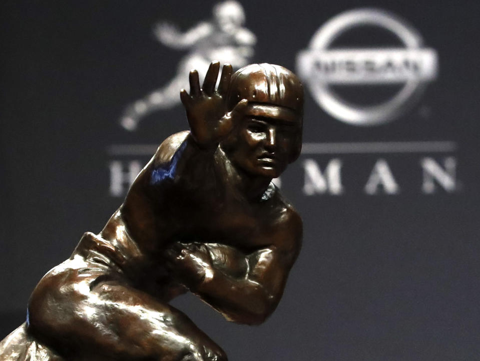 The Heisman Trophy appears on display during a news conference before the Heisman Trophy ceremony, Saturday, Dec. 14, 2019, in New York. (AP Photo/Jason Szenes)