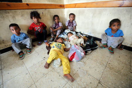 Children sit in a classroom of a school to which they have been evacuated from a village near Hodeidah airport amid fighting between government forces and Houthi fighters in Hodeidah, Yemen June 17, 2018. REUTERS/Abduljabbar Zeyad