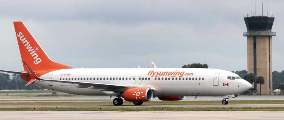 A Sunwing Airlines jet from Toronto, Canada, can be seen at Daytona Beach International Airport in this file photo.