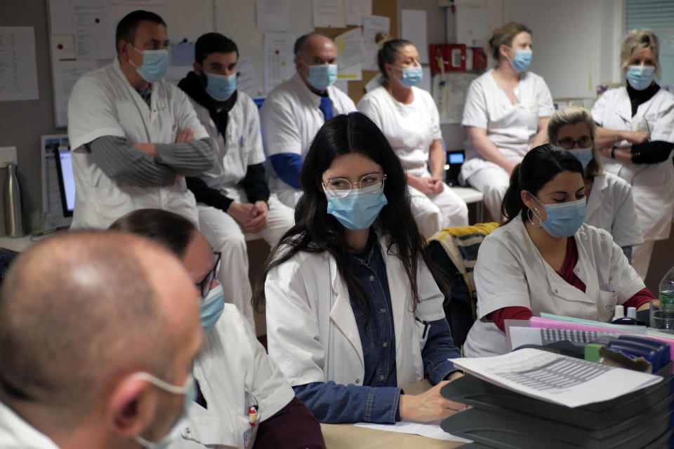 Medical staff attend a team meeting at the emergency ward of the Rouvray psychiatric hospital, in Rouen, western France, Wednesday, Nov. 25, 2020. Lockdowns that France has used to fight the coronavirus have come at considerable cost to mental health. Surveying points to a surge of depression most acute among people without work, in financial hardship and young adults. (AP Photo/Thibault Camus)