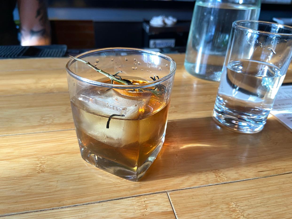 A Japanese-inspired cocktail at Poke Sushi in Rochester, the "Don't Be Shy" features a mix of Japanese whisky, candied orange, vermouth and scorched rosemary — plus a dash of soy sauce.