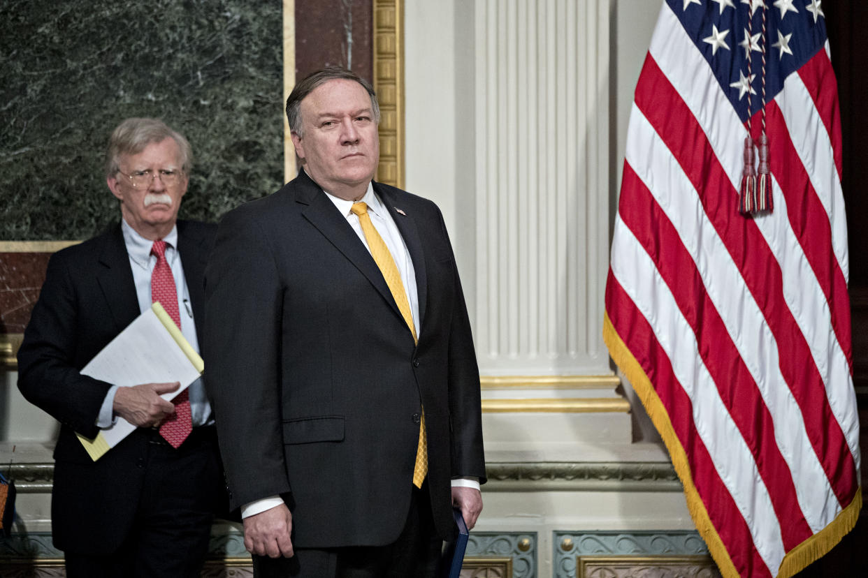 John Bolton, left, and Mike Pompeo