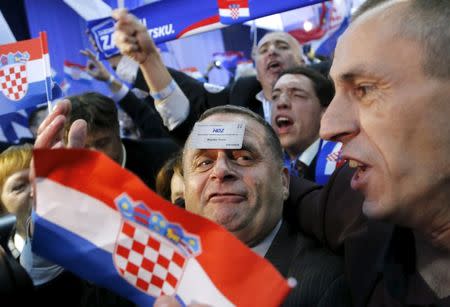 Supporters of the Croatian Democratic Union (HDZ) celebrate after exit polls in Zagreb, Croatia, November 8, 2015. REUTERS/Antonio Bronic