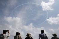 South Korea's Black Eagles aerobatics team perform the Taegeuk maneuver during a preview of the Singapore Airshow at Changi exhibition center in Singapore February 14, 2016. REUTERS/Edgar Su