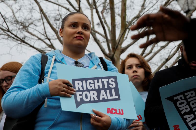 People rally outside the tenth Democratic 2020 presidential debate at the Gaillard Center in Charleston